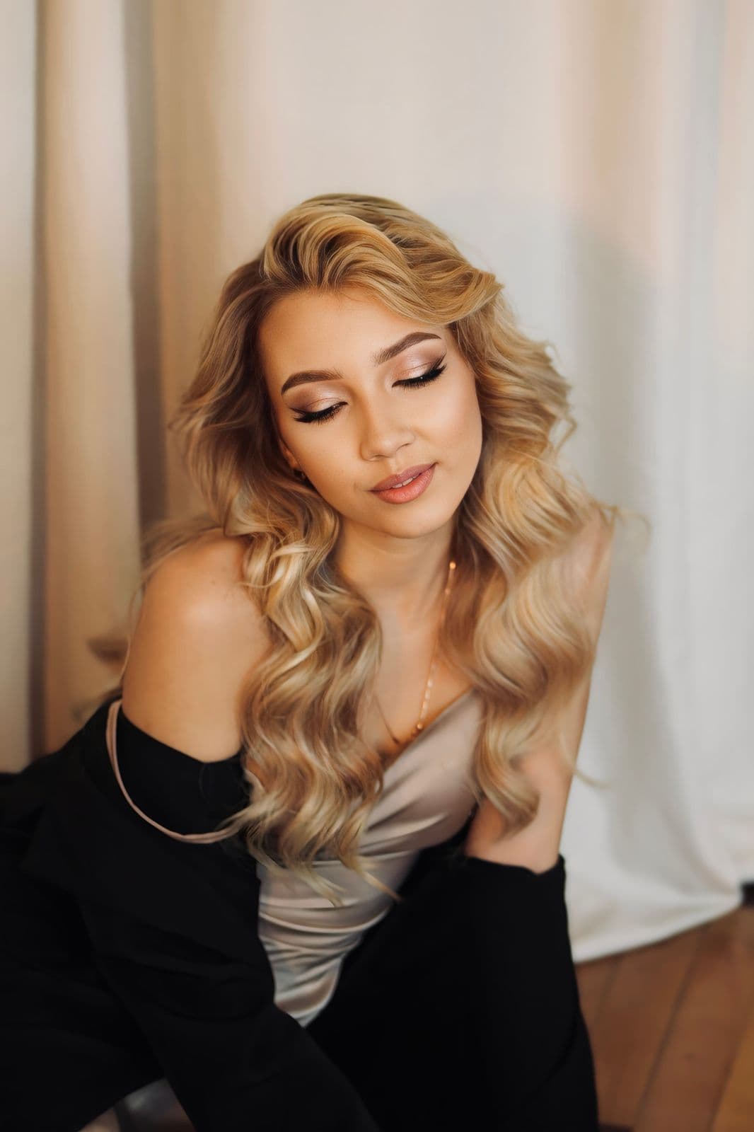 Woman with long softly waved blonde hair