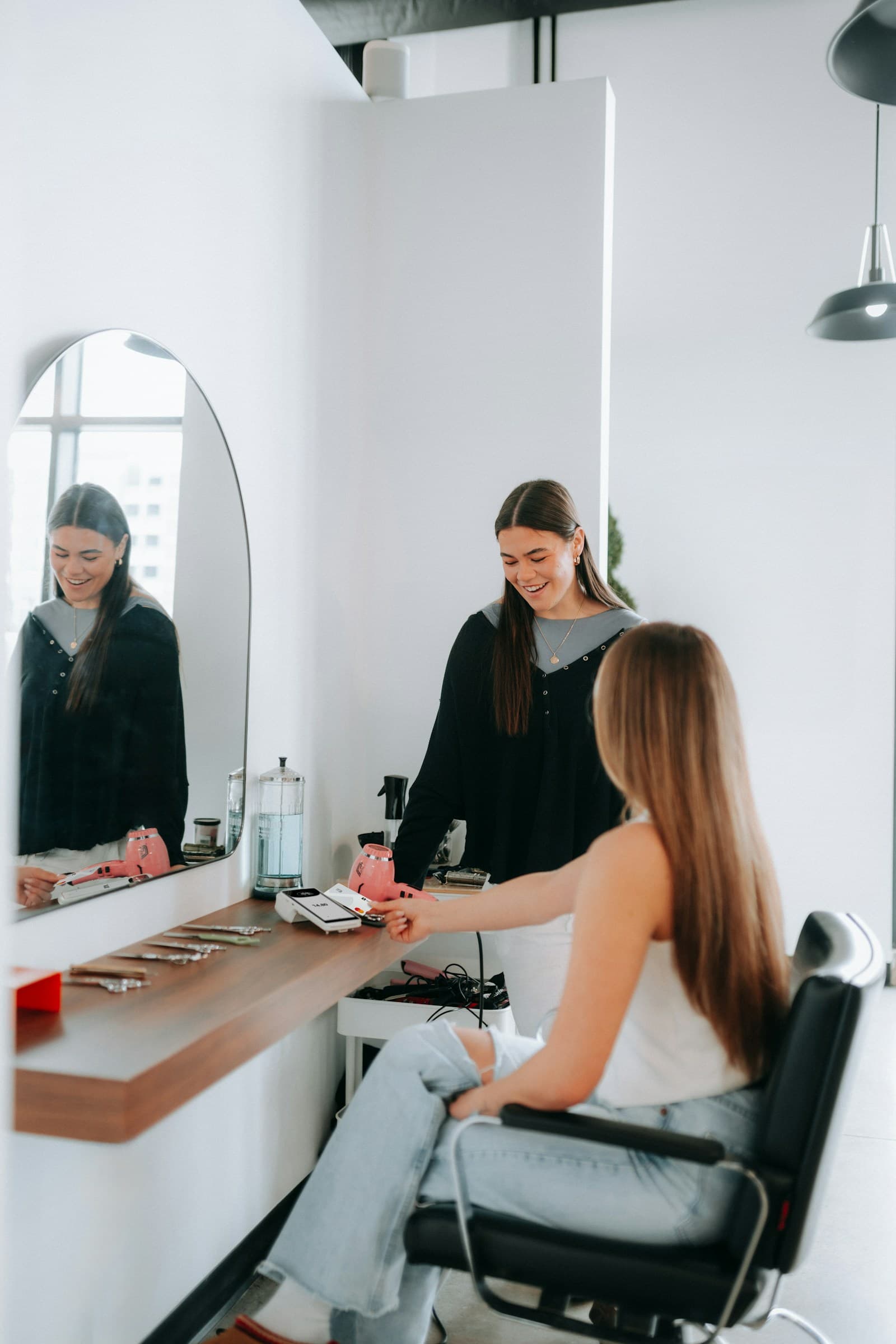 Hairstylist and client talking during a salon appointment