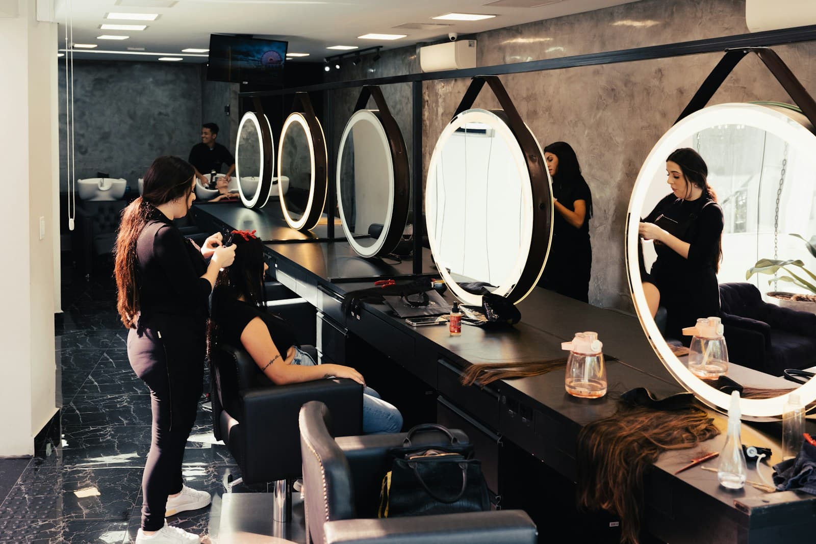 Client having her hair styled in the salon